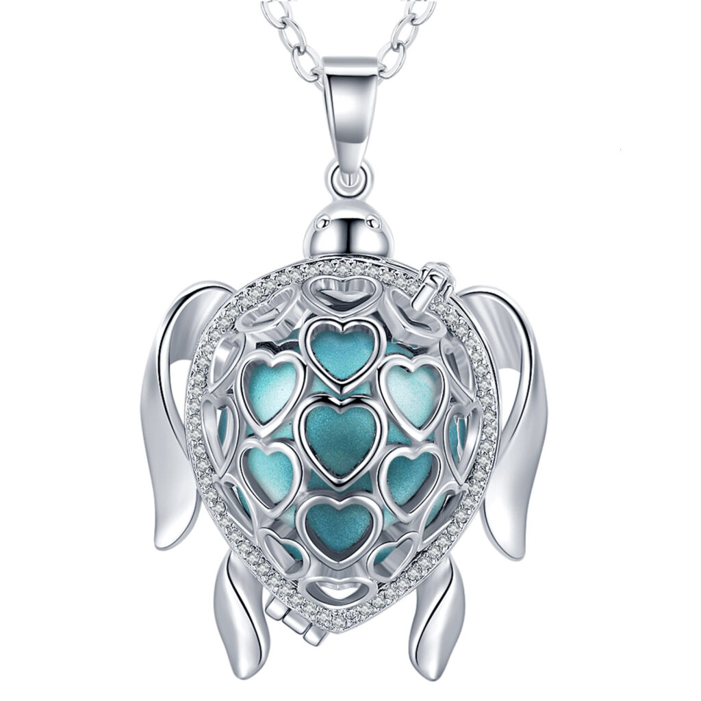 On voit un bola de grossesse en forme de tortue. La bille est bleue à l'intérieur de la cage.