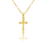 Sur fond blanc, on voit un collier avec un pendentif croix dorée.