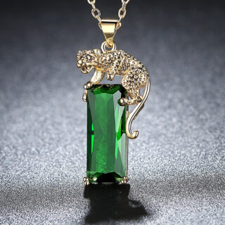 Pendentif panthère en alliage doré et cristal vert